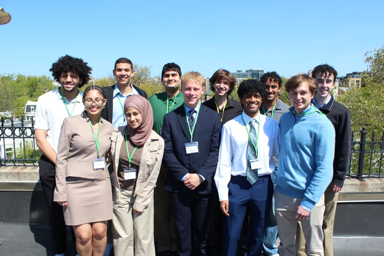 Participants posing on a rooftop at DCMC 1.0